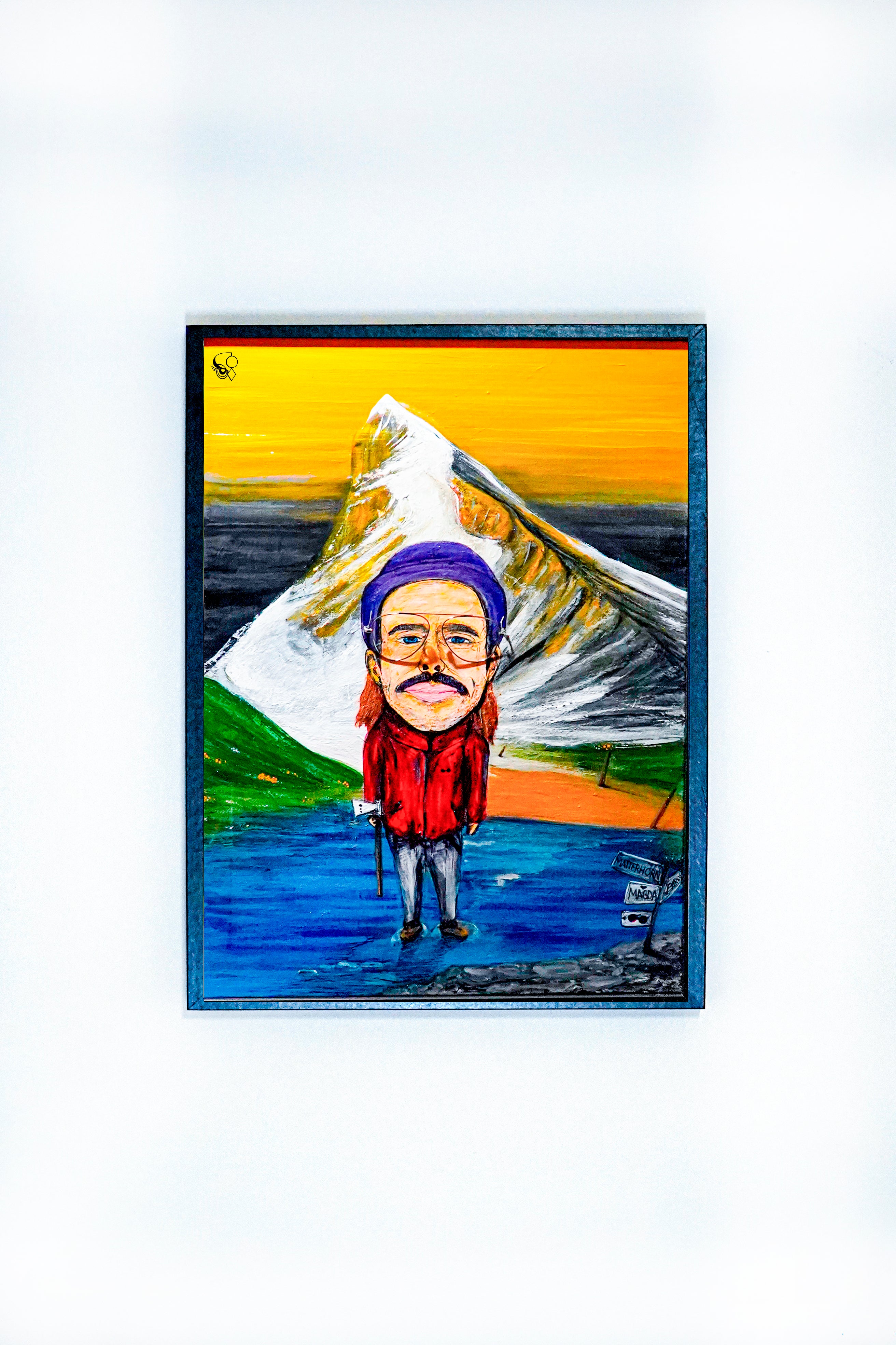 Painting of a mountain climber with a purple hat and red jacket standing near a snowy peak with a vibrant orange sky background